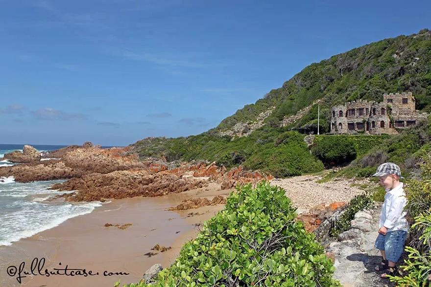 Young boy walking on a coastal path of Noetzie Beach near Knysna