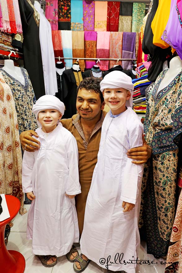 Children tourists wearing local traditional outfits in Dubai