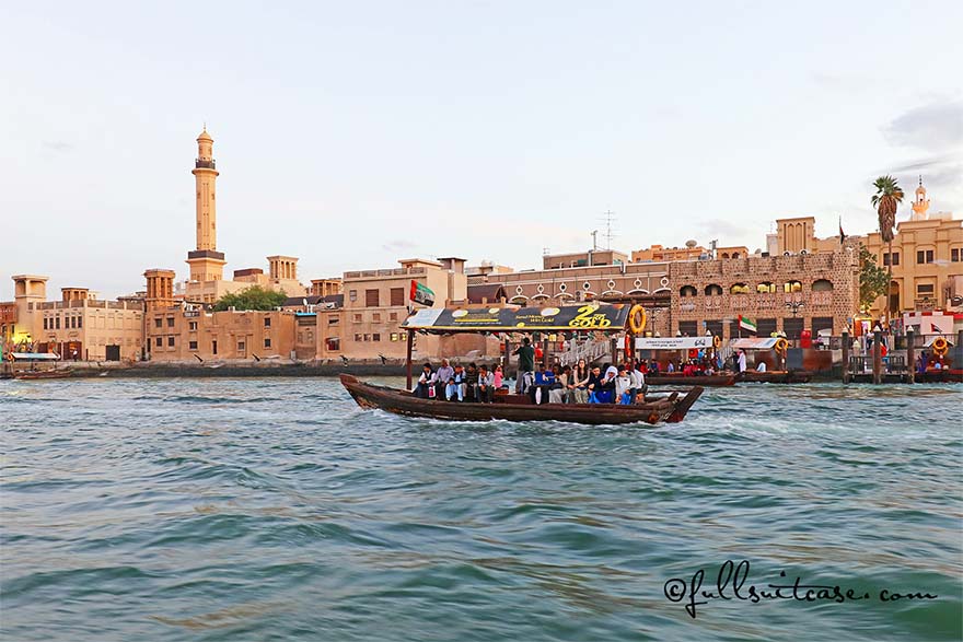 Dubai downtown and traditional water taxi Abra as seen from the Dubai Creek