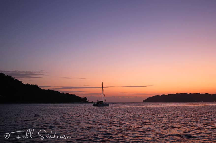 Sailing in the Seychelles at sunset in the evening