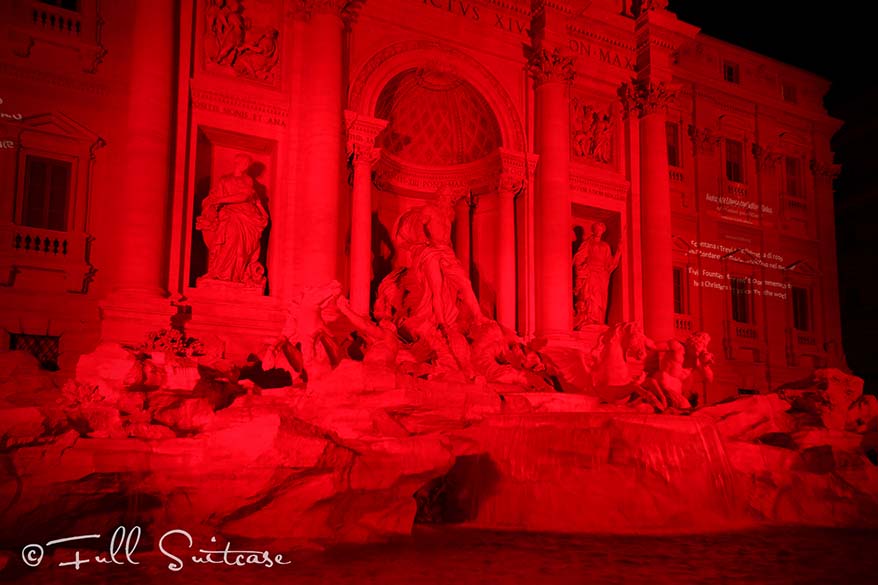 Trevi fountain at night in red in memory of the persecuted Christian martyrs