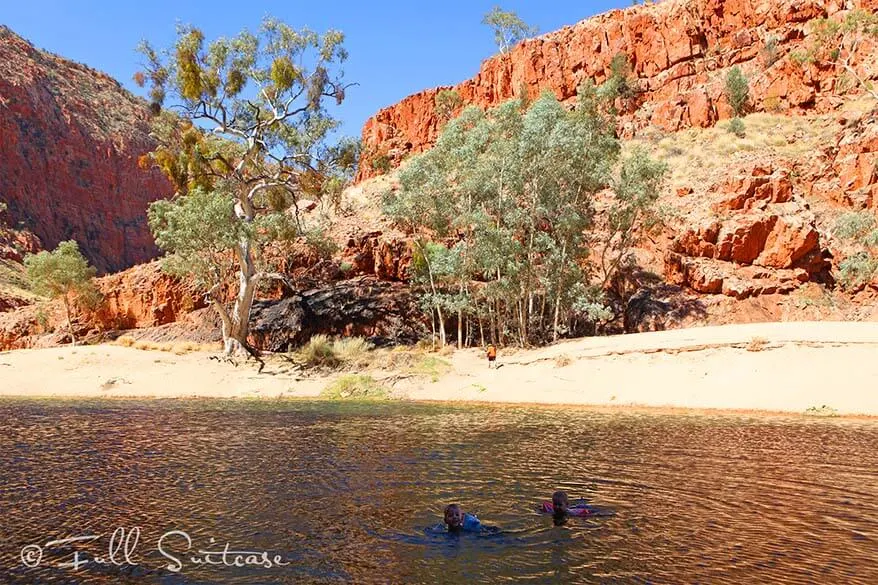 Kids swimming in Ormiston Gorge, West MacDonnell Ranges Australia