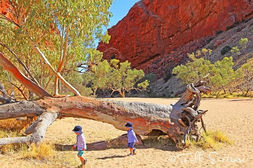 Kids exploring Simpsons Gap in West MacDonnell Ranges Australia