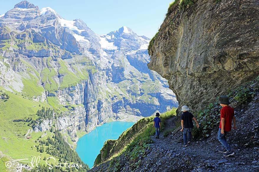 Children hiking at Oeschinensee in Switzerland