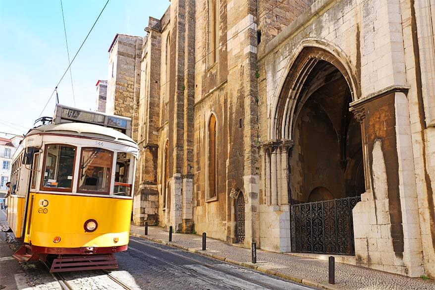 Famous Lisbon tram 28 passing the Se Cathedral