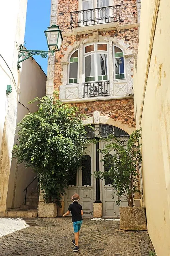 Walking the narrow streets of Alfama district in Lisbon