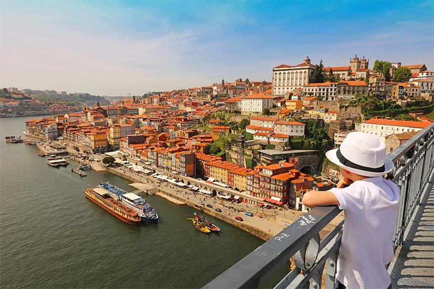 Admiring the view over the old town in Porto, Portugal with kids