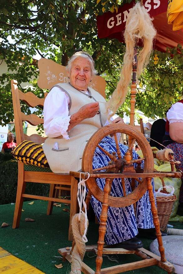 Local women demonstrating traditional handcrafts at the farmers market in Tirol Austria