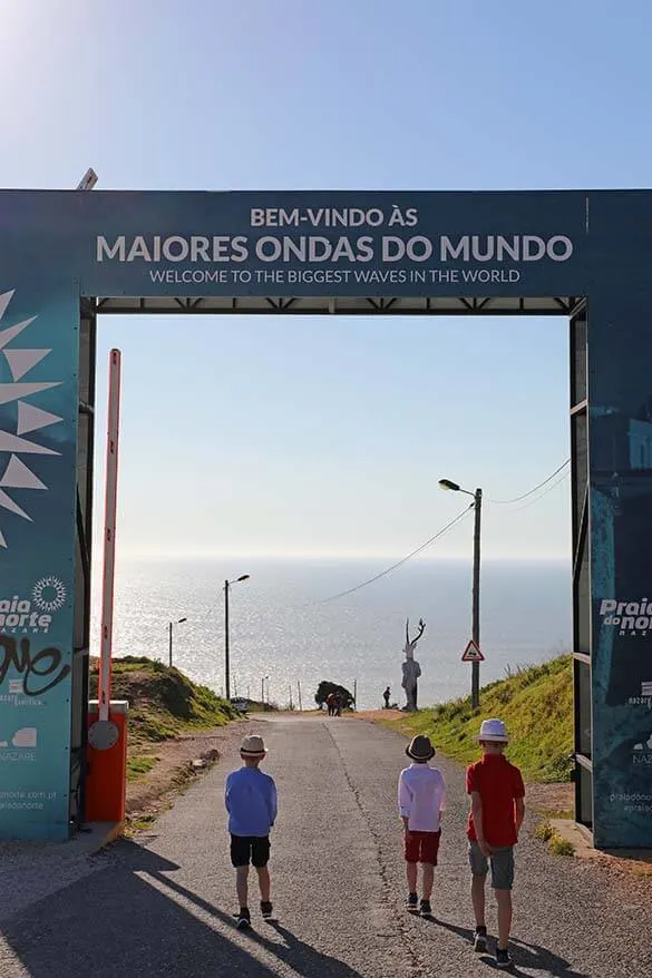 Walking towards Nazare lighthouse famous for the giant waves along the coast