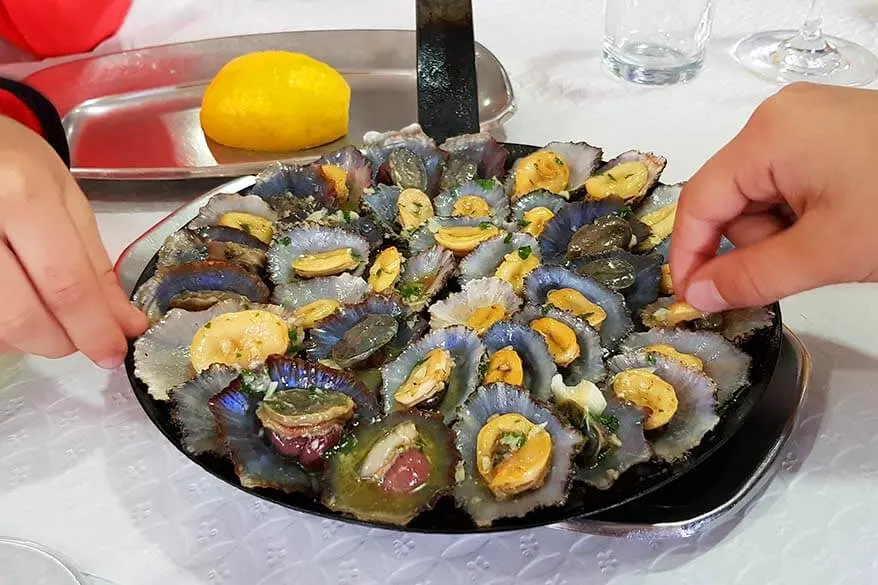 Eating limpets at a local restaurant in Madeira