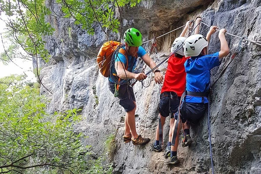 Climbing along Ferrata Preore in Italy with kids