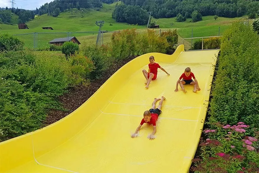Family water fun at a swimming pool in St Anton am Arlberg in Tyrol