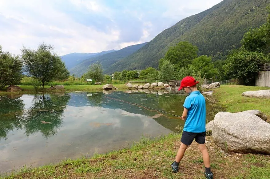 Kids fishing in Trentino Italy