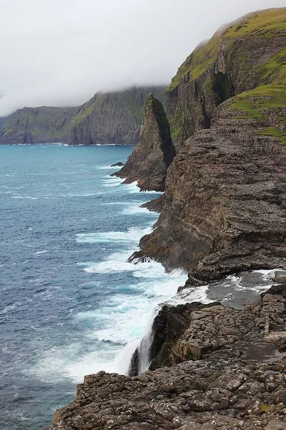 Bosdalafossur waterfall and the stunning coastline of Vagar island in the Faroe Islands