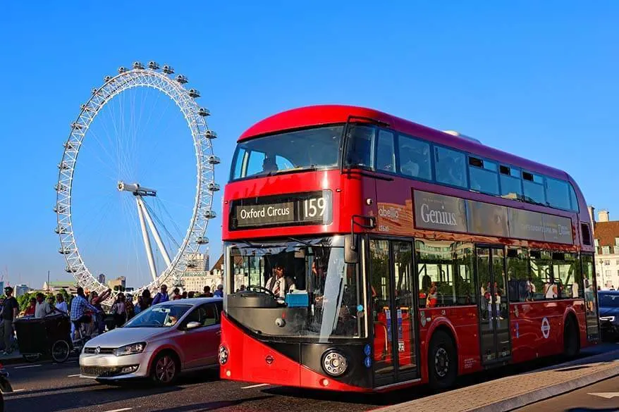 Red double-decker bus on the Westminster Bridge in London