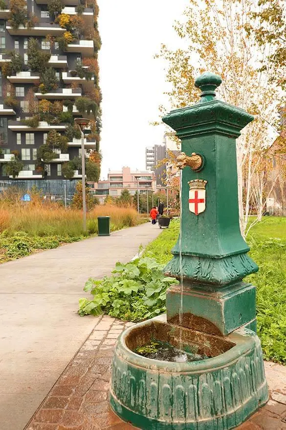Traditional Italian water tap in a modern Porta Nuova district in Milan