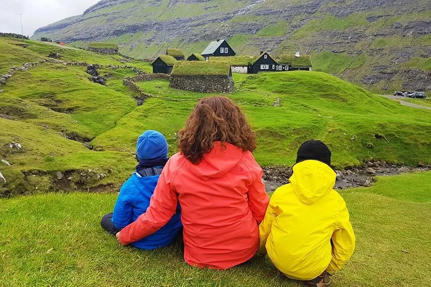 Family in Saksun village on the Faroe Islands - even in summer, you need to dress really warm
