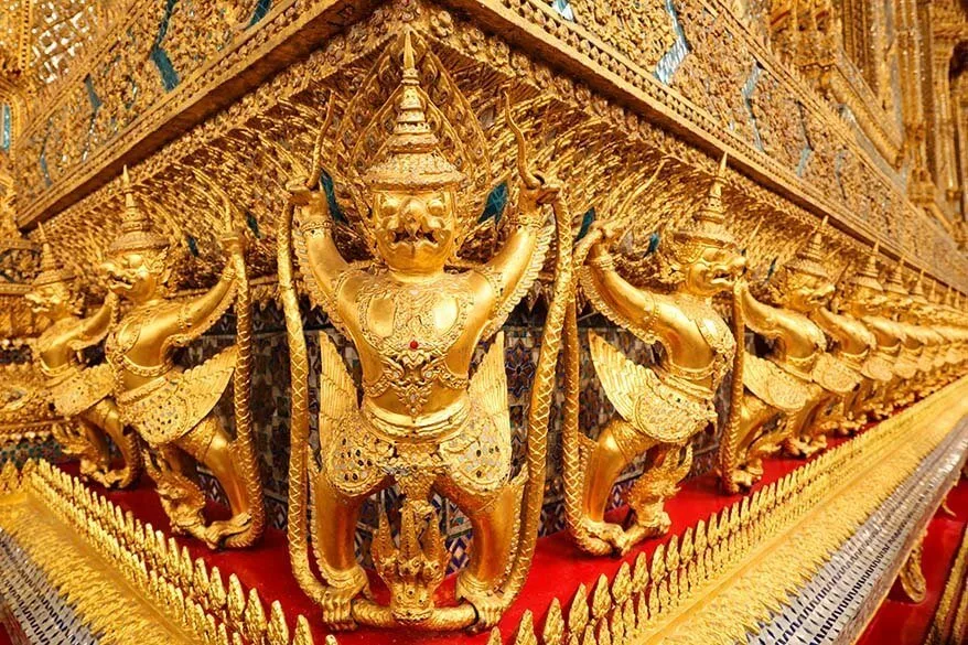 Golden exterior detail of the Emerald Buddha Temple in the Grand Palace in Bangkok Thailand