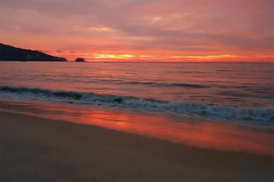 Red sunset at Nai Yang Beach in Sirinat National Park in Phuket Thailand