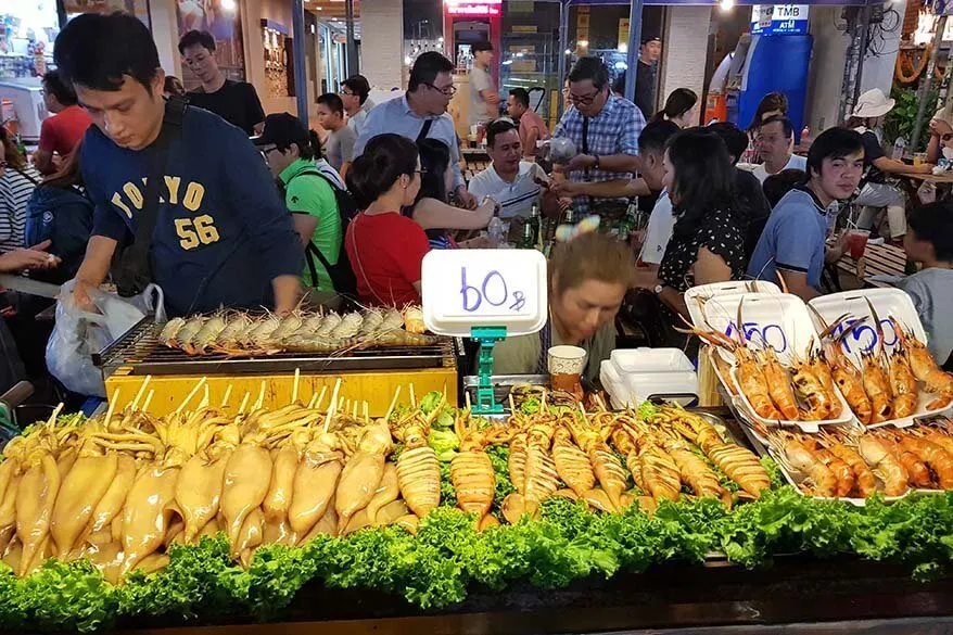 Street food stall selling seafood on Khao San road in Bangkok