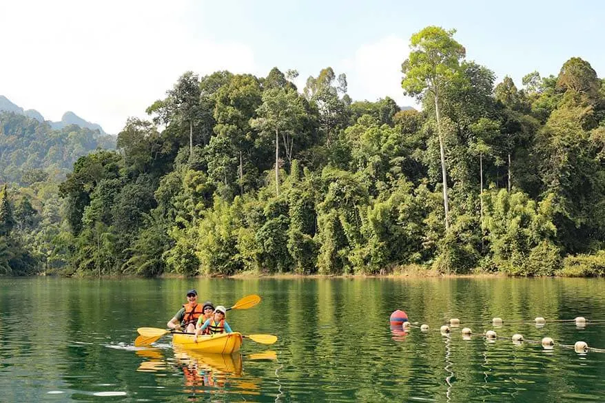 Family kayaking at the Rainforest Camp at Elephant Hills resort Thailand
