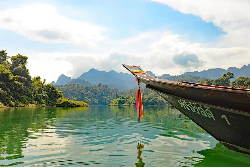 Long tail boat on Cheow Lan Lake in Khao Sok National Park Thailand