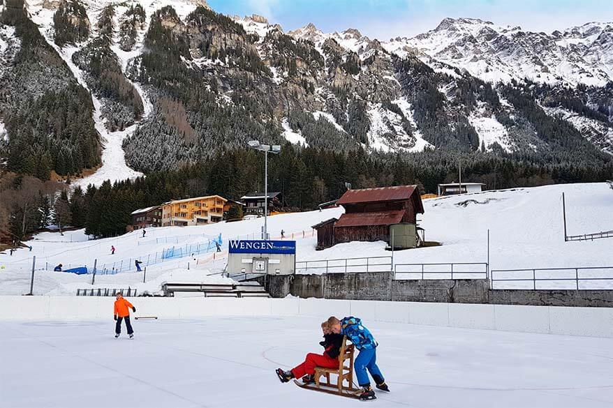 Kids ice skating in Wengen Switzerland