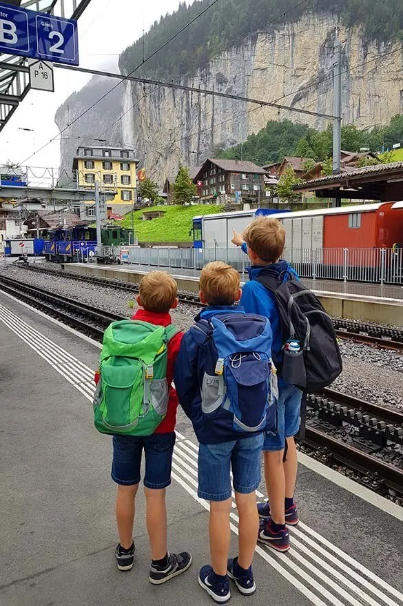 Kids with travel backpacks in Switzerland