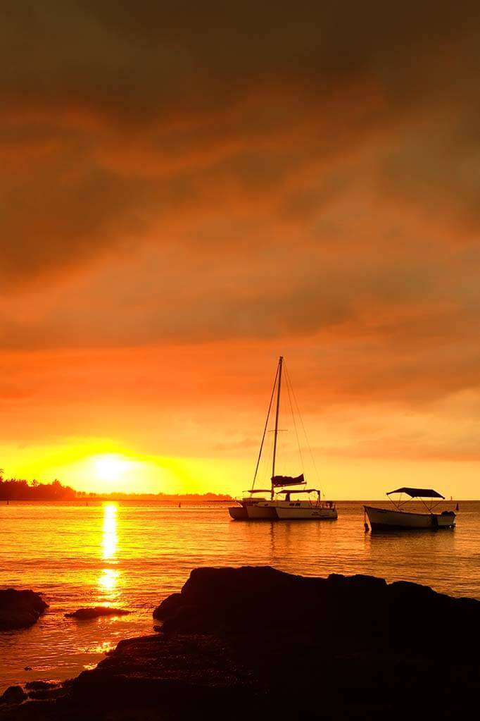 A catamaran in Mauritius at sunset