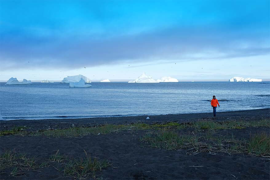 Black sand beach with icebergs on Disko Island in Greenland