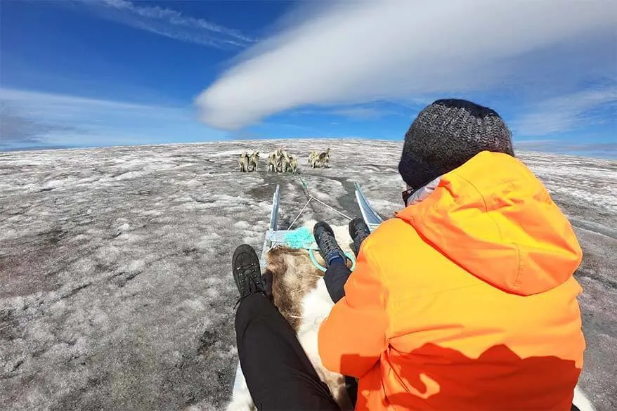 Dog sledding on Lyngmark Glacier on Disko Island in Greenland