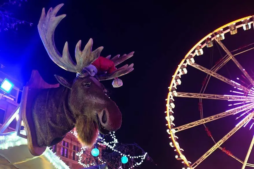 Fun market stall with a moose at Brussels Ferris wheel during Winter Wonders festive season in Belgium