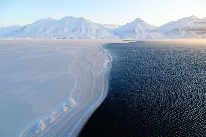 Ice meets the ocean - frozen Arctic sea near Pyramiden in winter