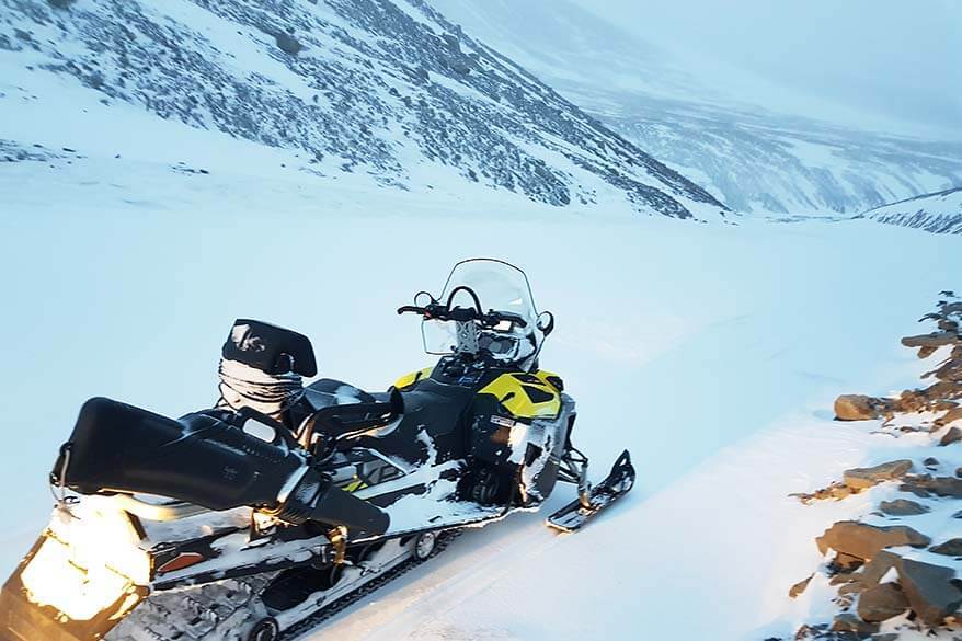 Snowmobile safari tour guides carry guns for polar bear protection