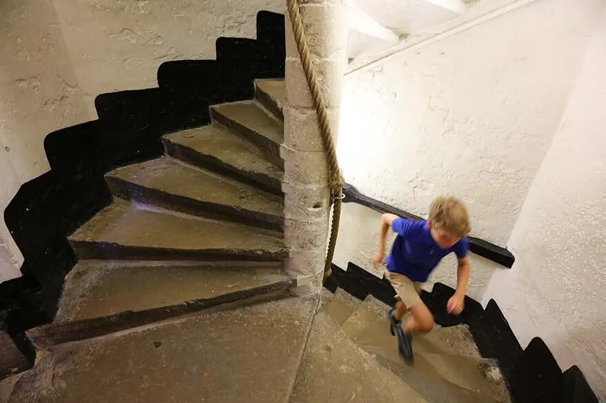 Child climbing the stairs of Belfort in Brugge