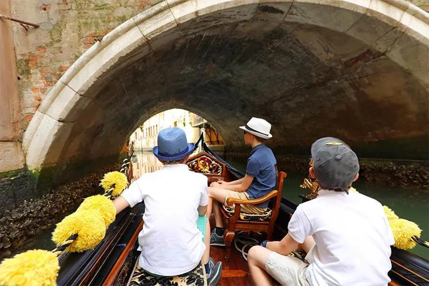 Gondola ride under a bridge in Venice