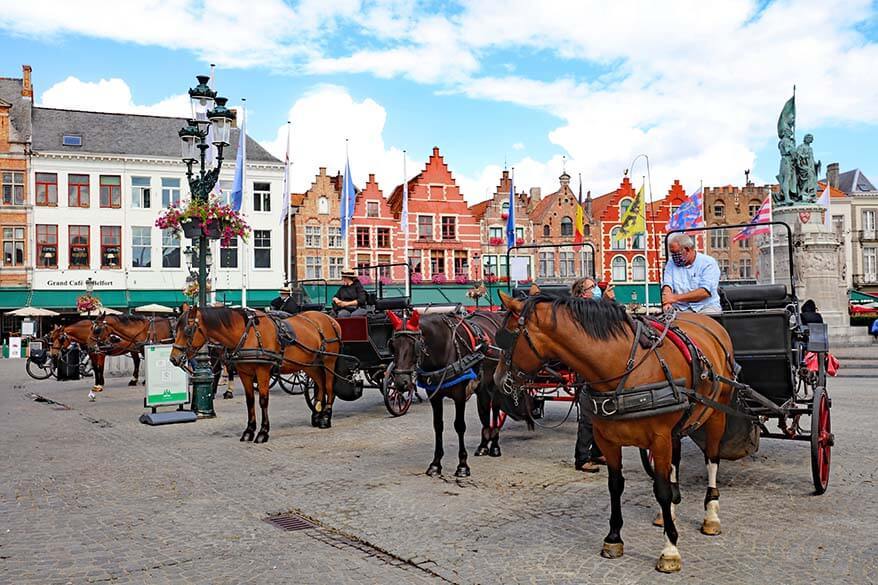 Horses and carriages on the Market Square in Bruges