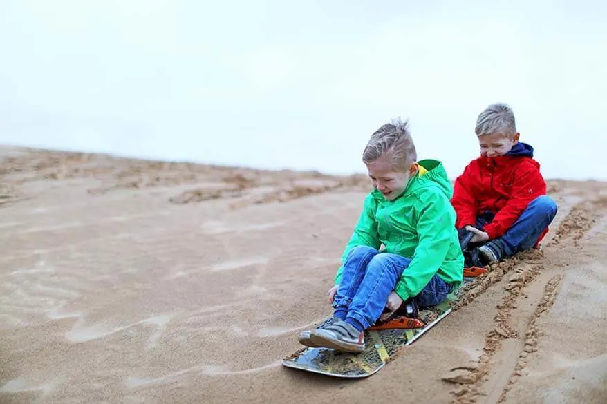 Dubai with kids - sandboarding in the desert