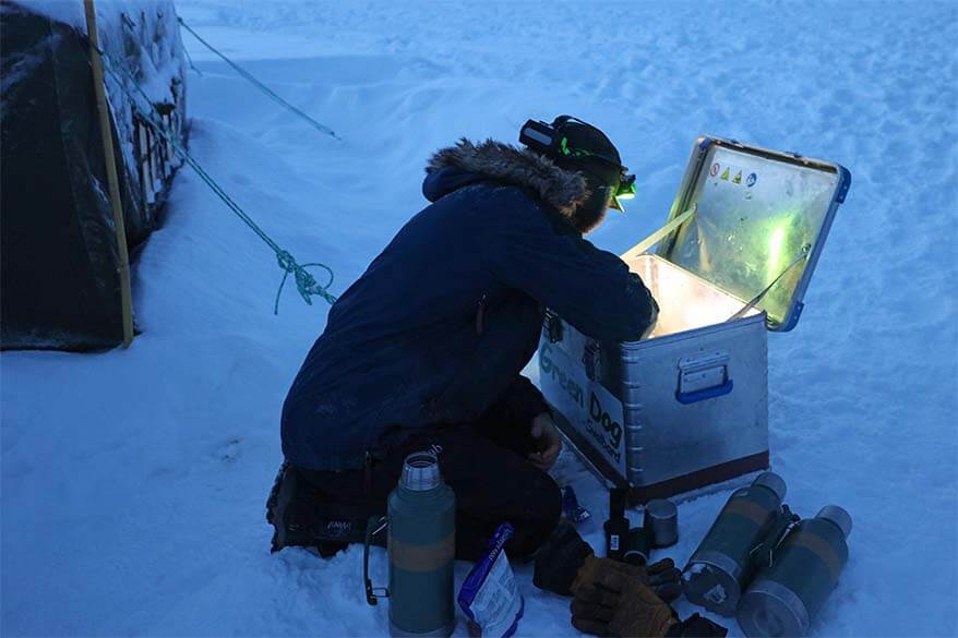 Svalbard dog sledding tour guide preparing lunch