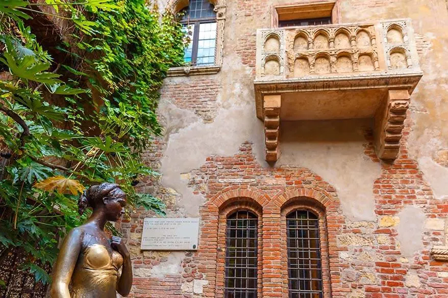 Juliet's statue, house, and balcony in Verona Italy