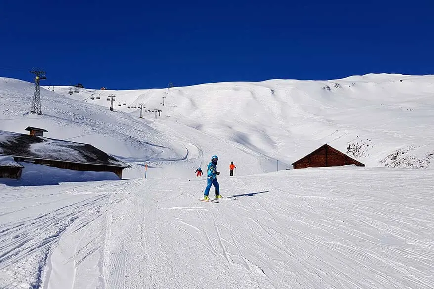 Kids skiing near Mannlichen in the Grindelwald Wengen ski area in Switzerland