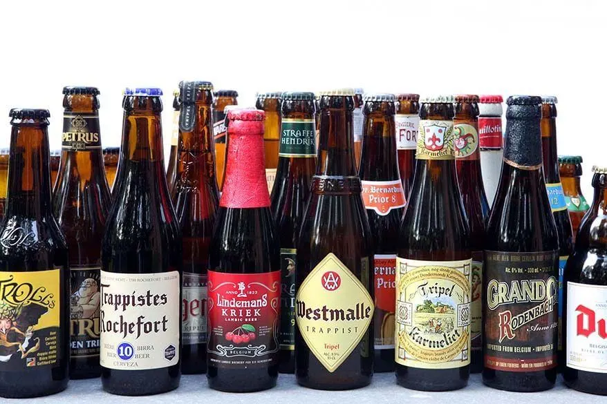 Lots of different bottles of Belgian beer