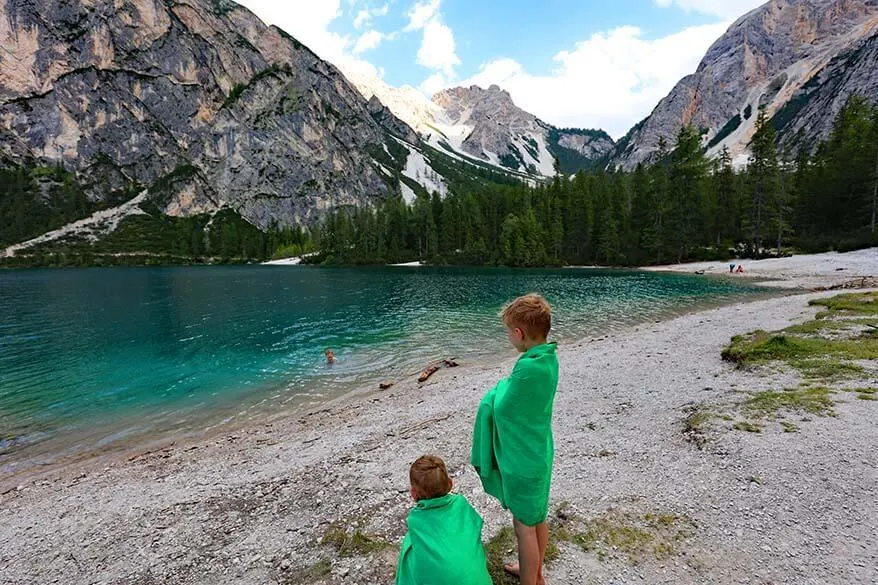 Kids swimming at Lago di Braies in summer