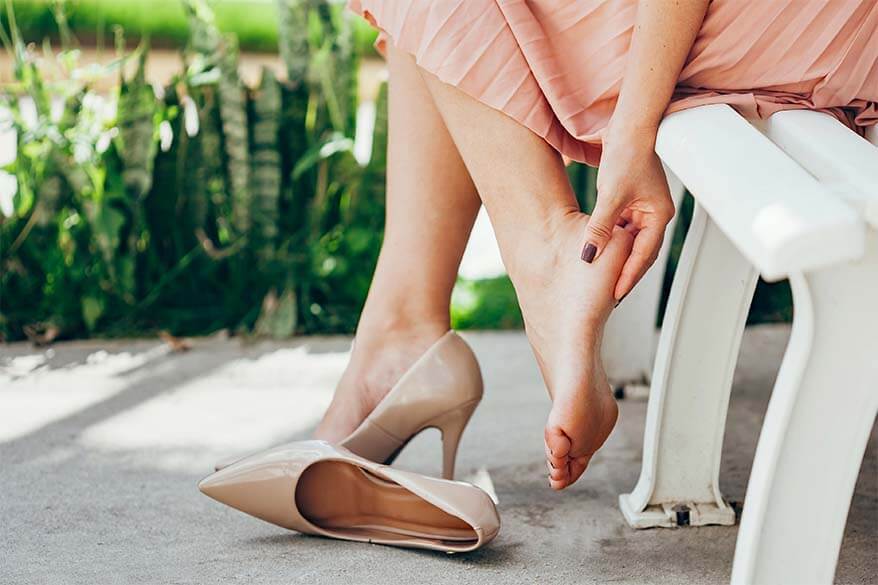 A woman with feet pain from high heel shoes