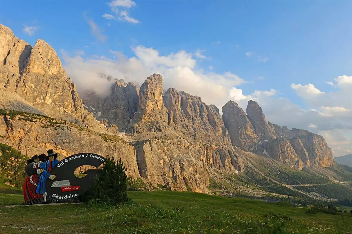 Val Gardena sign and mountain scenery at Gardena Pass in the Dolomites Italy