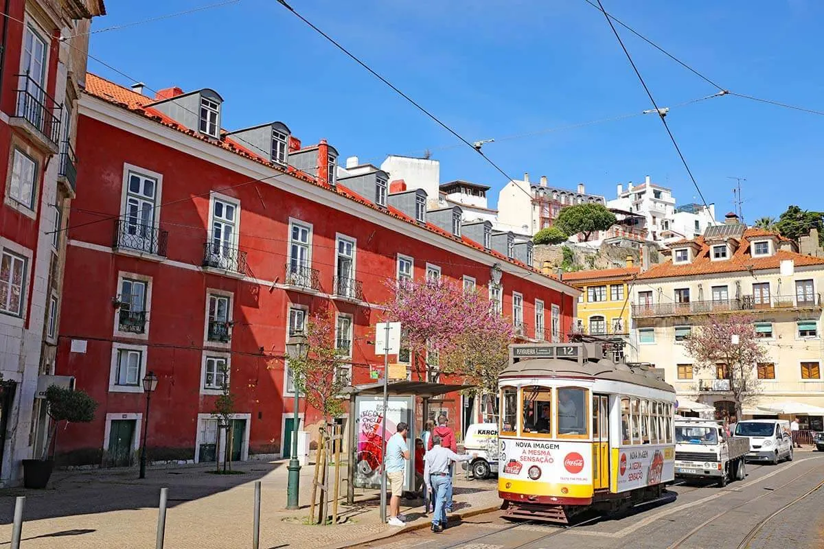 Colorful buildings and traditional tram in Alfama Lisbon