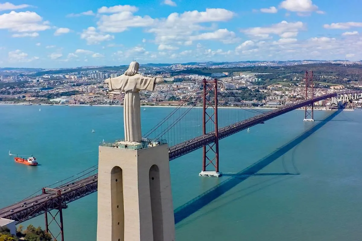 Cristo Rei statue and April 25 Bridge in Lisbon