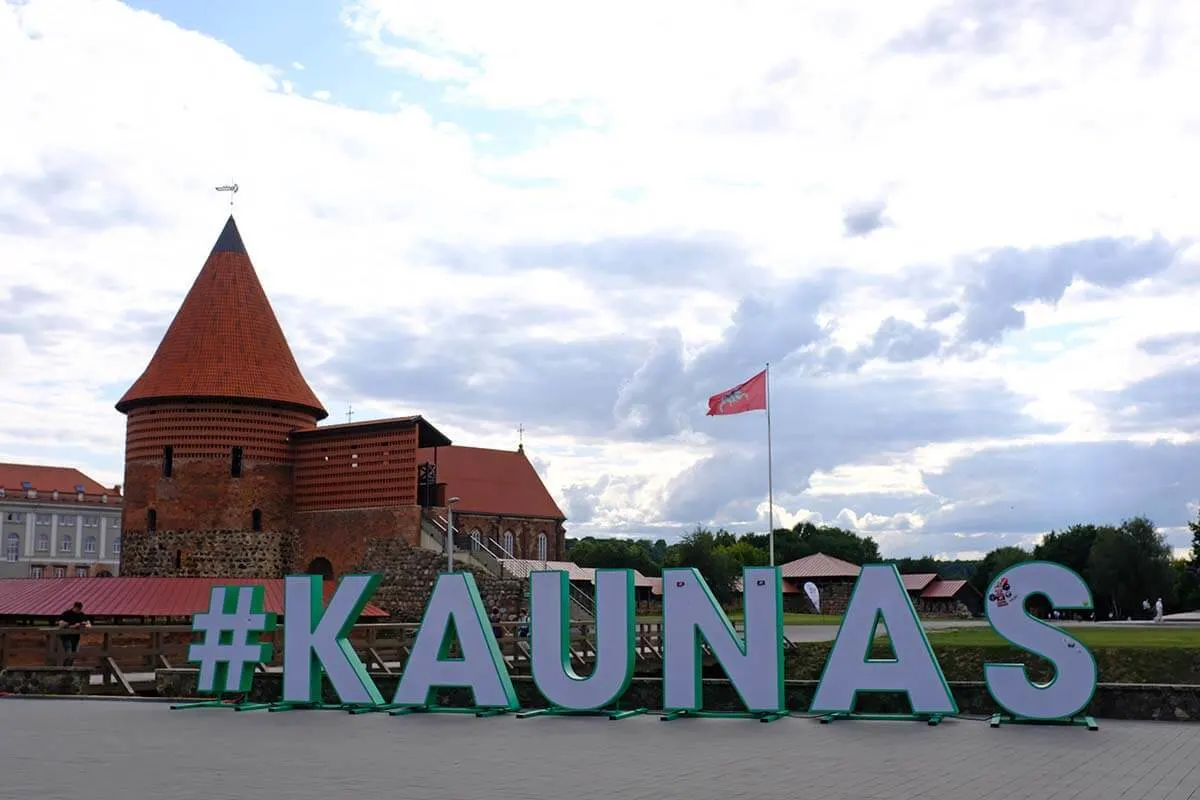 Kaunas sign and castle in Lithuania