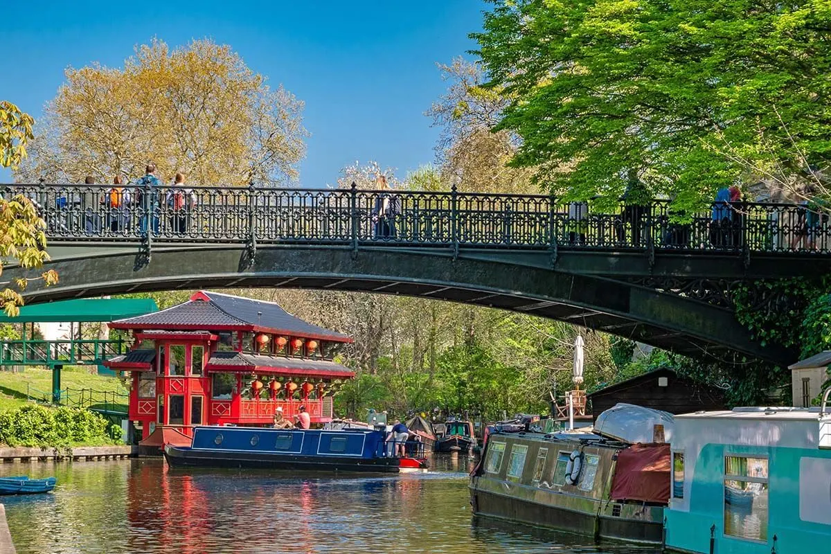 Regent's Canal with colorful boats and floating Chinese pagoda restaurant