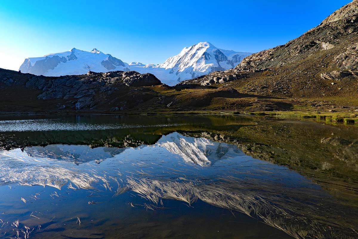 Mountain reflections on Riffelsee lake in Zermatt